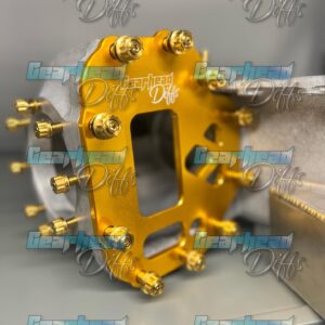 Close-up of the gold-coloured GEARHEAD DIFFS GT-R FRONT DIFF BRACE KIT (R32/R33/R34/RB 4WB) with multiple bolts, resting on a grey surface. The "Gearhead Diffs" logo appears repeatedly across the image.